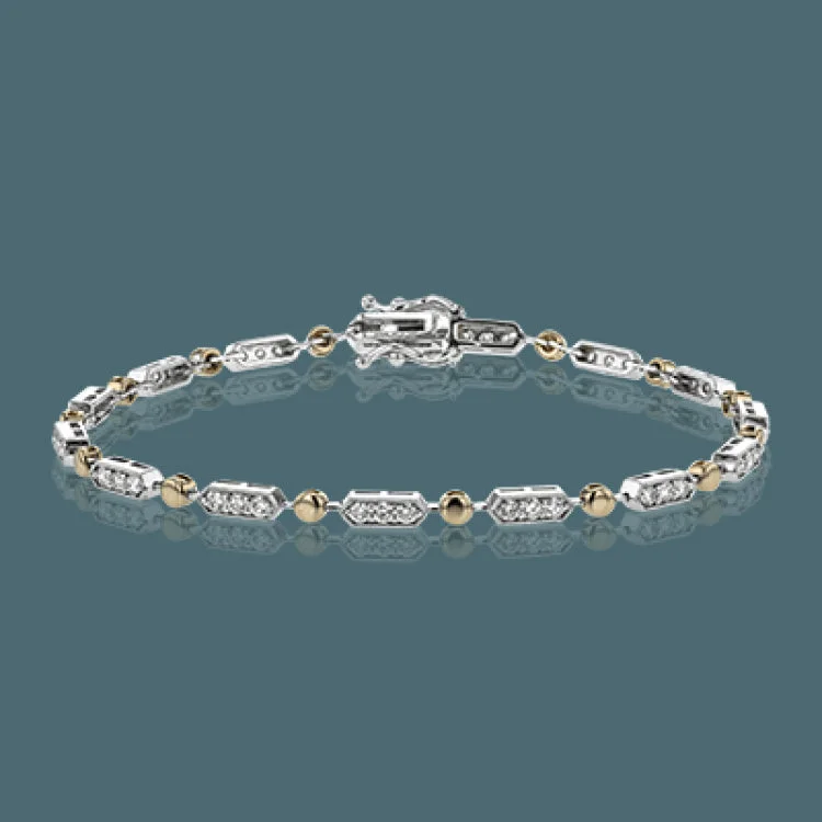 Women’s gold bangle bracelets-The delicate, geometric design of this bracelet alternates 1.00 ctw of white diamonds set in white gold with subtle rose gold accents