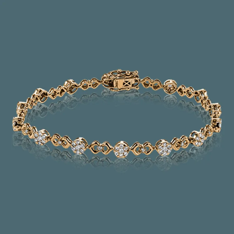 Women’s pearl bracelets-This unique bracelet shows off a total 1.15 ctw of round white diamonds in white gold settings accented by charming rose gold details