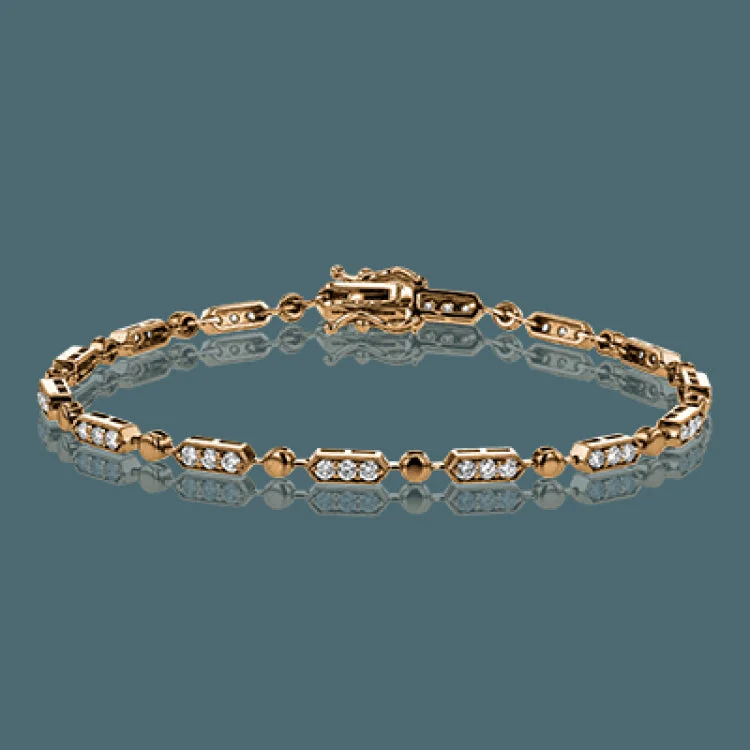 Women’s statement bracelets-The delicate, geometric design of this bracelet alternates 1.00 ctw of white diamonds set in white gold with subtle rose gold accents