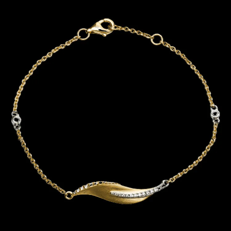 Women’s beaded bracelets-This nature-inspired 18k yellow gold bracelet contains .20 ctw of diamonds in a leaf design.