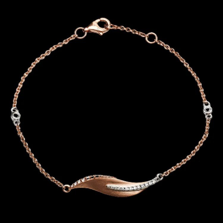 Women’s thick gold bangles-This nature-inspired 18k rose gold bracelet contains .20 ctw of diamonds in a leaf design.