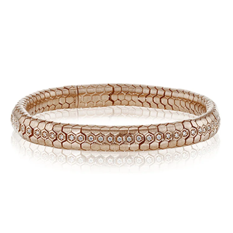 Women’s colorful bracelets-This sinuous 14k gold bracelet is set with .69 ctw of white diamonds.