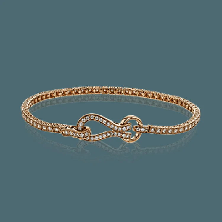 Women’s thick gold bangles-This lovely buckle bracelet contains a total of 1.00 ctw of white diamonds sparkling in its midst, and a durable buckle clasp design.