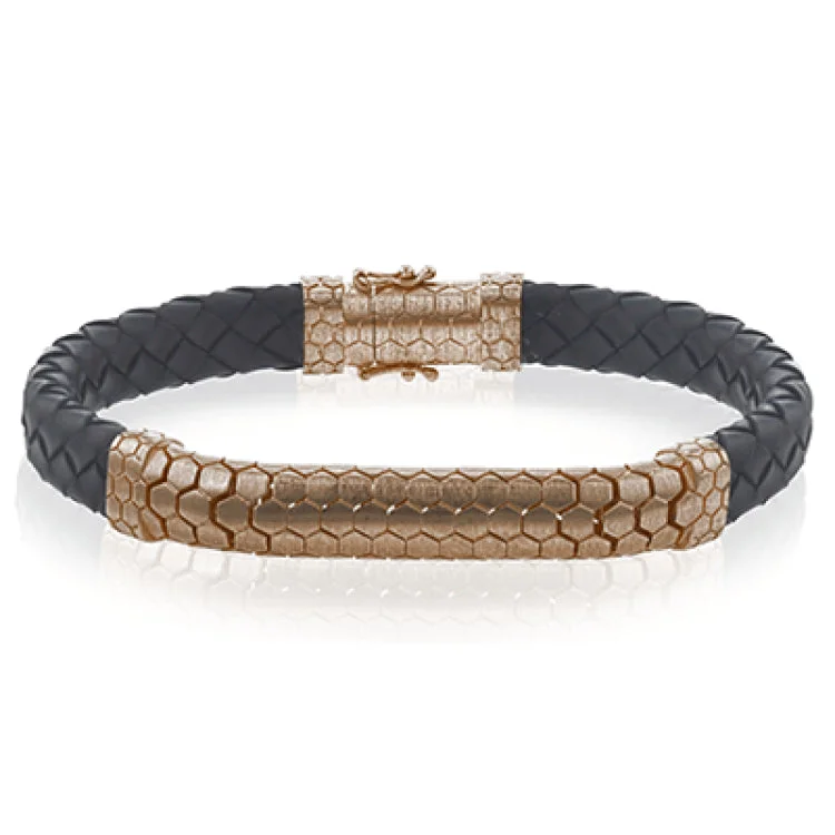 Women’s twisted bangles-This modern men's bracelet combines black leather and 14k rose gold to make a bold statement.