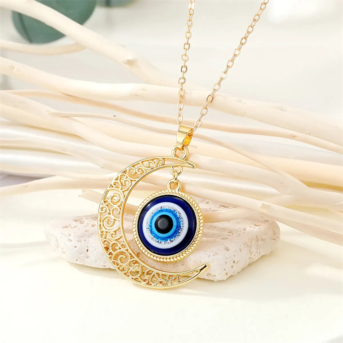 Women’s holiday necklaces-Fashion Retro Hollow Moon Blue Eye Alloy Necklace