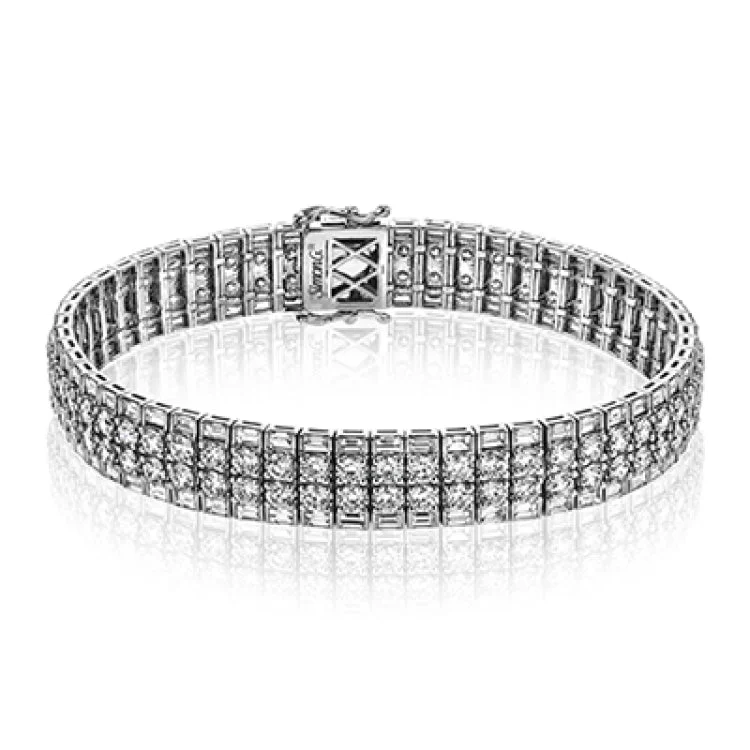 Women’s stackable bangles-Crafted in 18k white gold, this bracelet makes a bold, modern statement with 4.74 ctw baguette shaped diamonds and 7.68 ctw classic round diamonds.