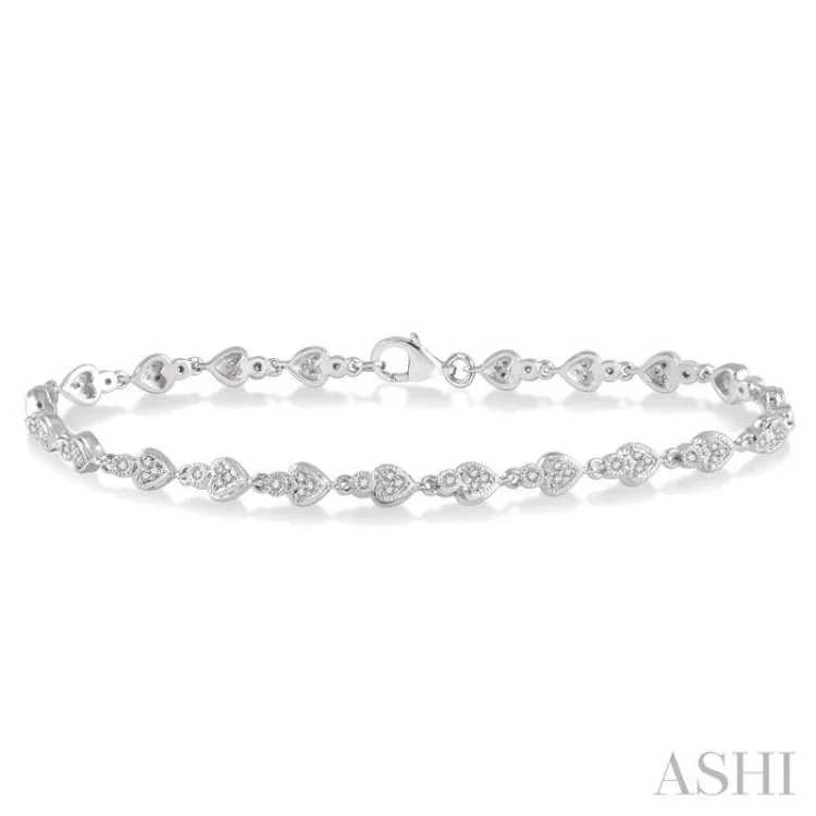 Women’s infinity bangles-1/3 ctw Heart Charm Round Cut Diamond Link Bracelet in 10K White Gold