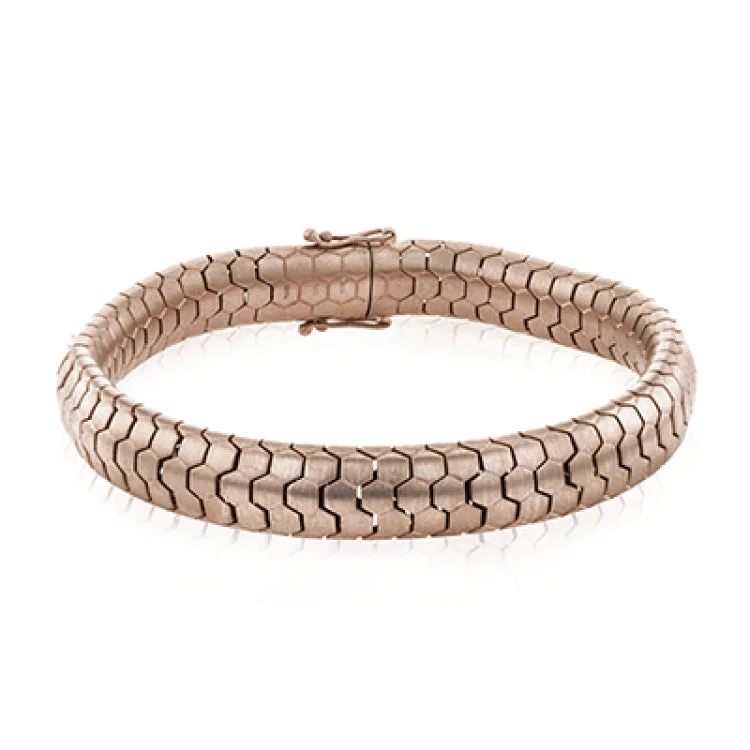 Women’s cuff bracelets-This 14k gold men's bracelet has geometric links that fit together in a snake-like pattern and is eminently comfortable.