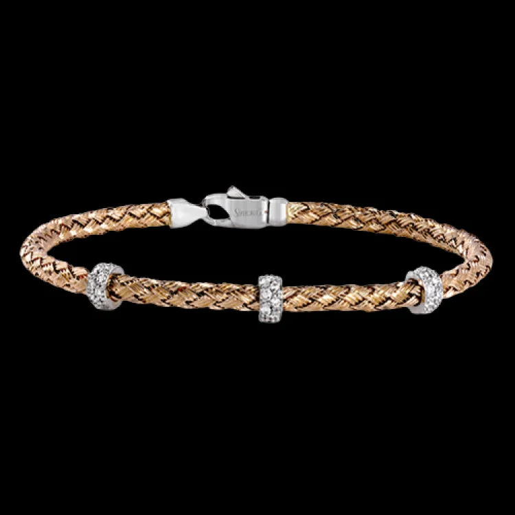 Women’s classic cuff bracelets-This wonderful bracelet is woven from pure 18k rose gold, with a rich warmth which sets off the .33 ctw of white diamonds in its midst. Perfect for stacking.