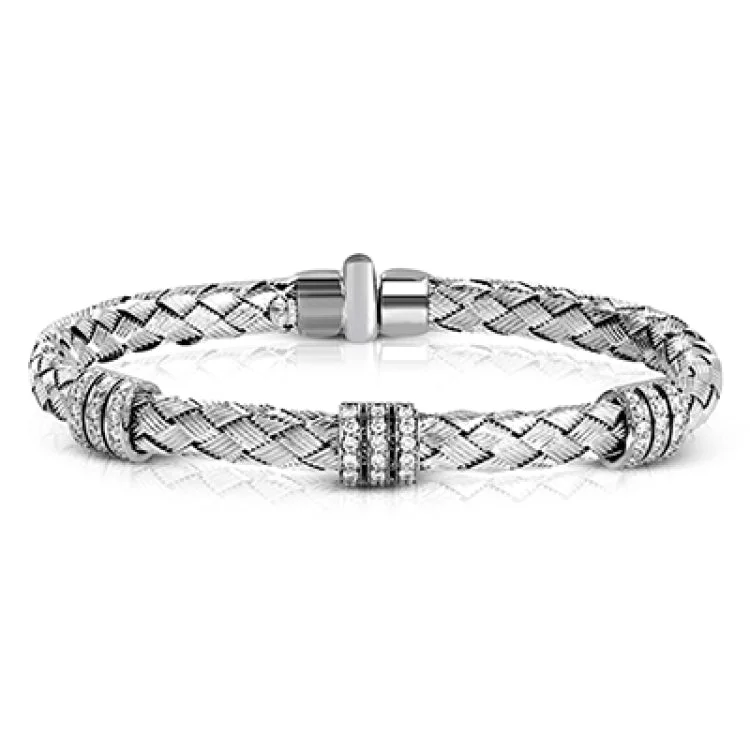 Women’s layered bangles-This 18k white gold bangle bracelet adds something special to any day. A total of .73 ctw of white diamonds add sparkle and shine to this amazing piece. Perfect for stacking.