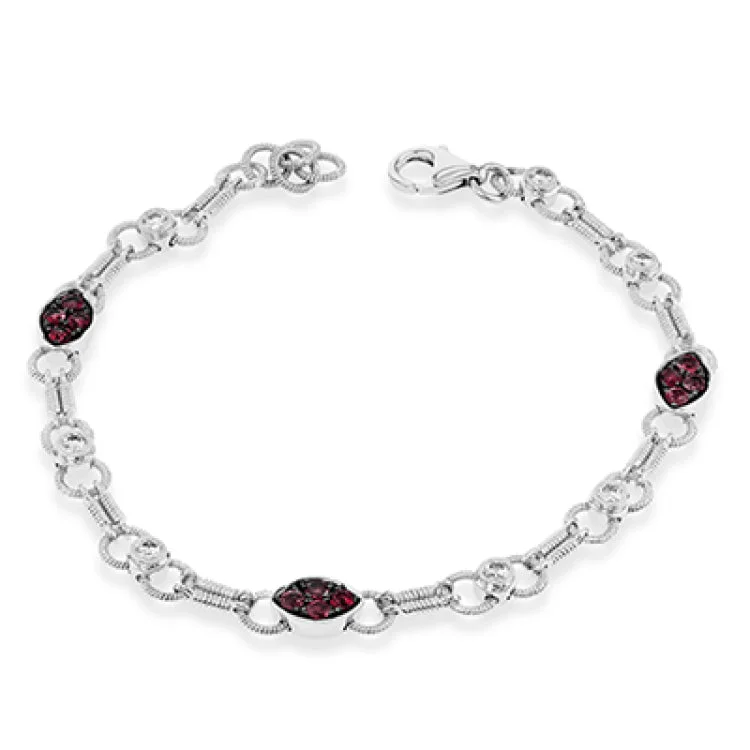 Women’s luxury charm bracelets-This wonderful 18k white gold link bracelet is set with .44 ctw of white diamonds and .98 ctw of warm red rubies.