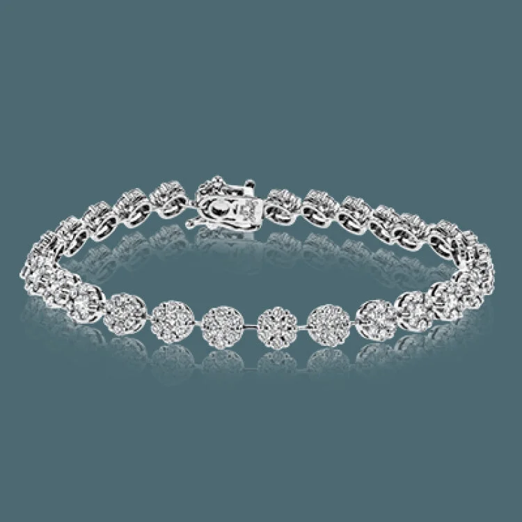 Women’s heart-shaped bracelets-This glamorous bracelet dazzles with an incredible 3.78 ctw of round white diamonds in a white gold setting