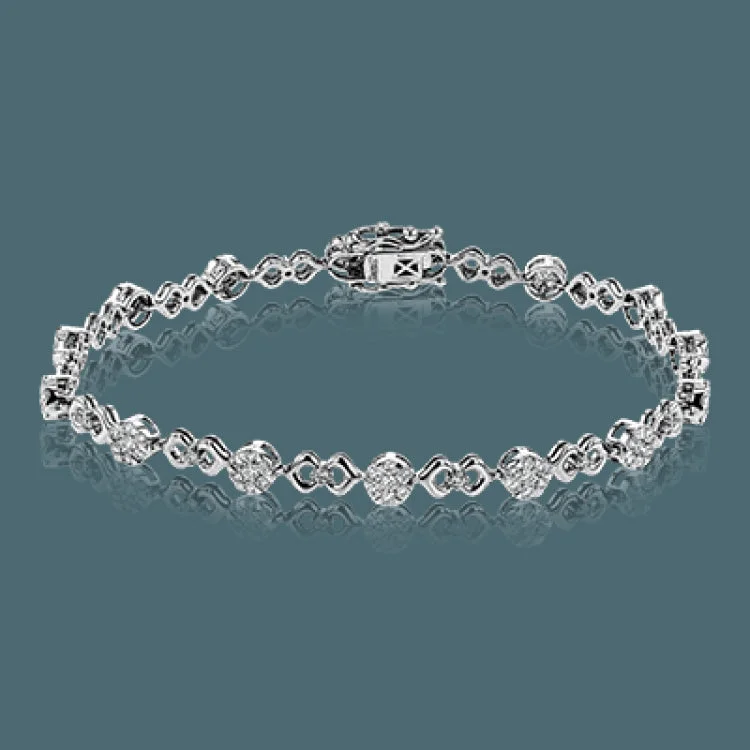 Women’s silver bracelets-This unique bracelet shows off a total 1.15 ctw of round white diamonds in white gold settings accented by charming rose gold details