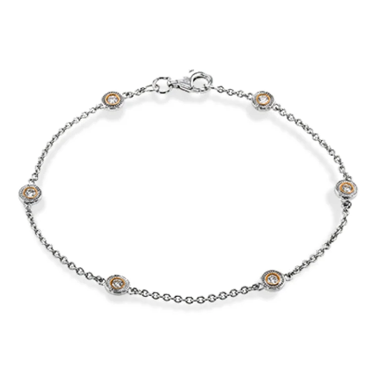 Women’s adjustable bangle bracelets-This two-tone 18k yellow and white gold bracelet contains .24 ctw of white diamond for the perfect accent of sparkle and shine.