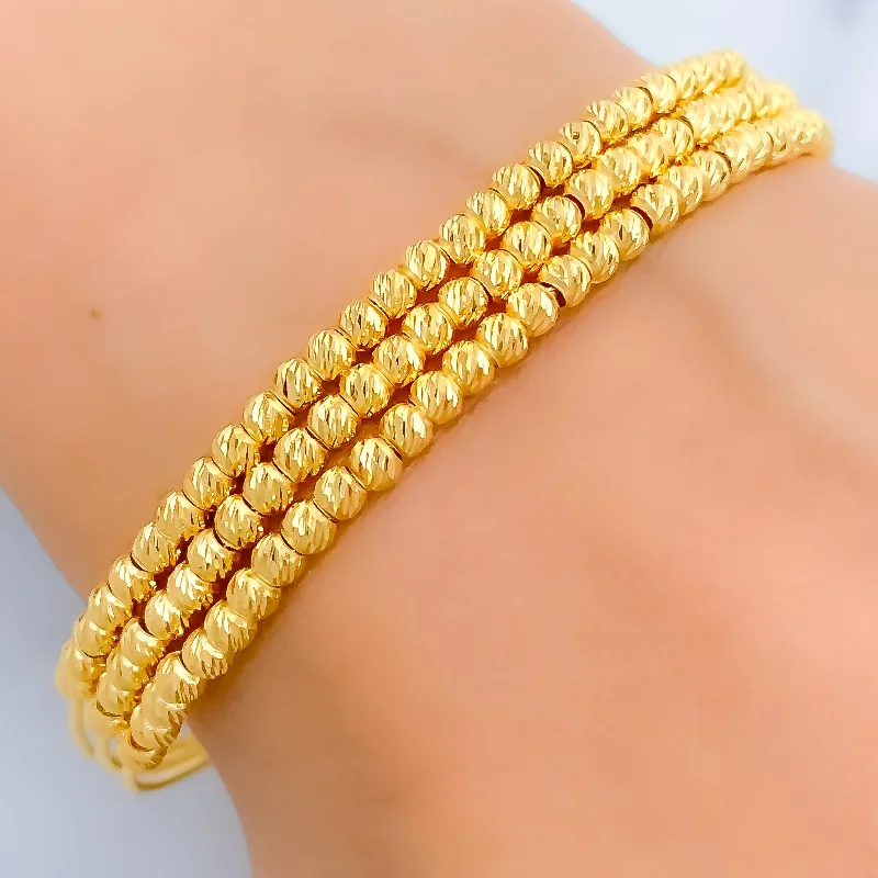 Women’s pearl bracelets-Shimmering Striped 22k Gold Bangle Bracelet