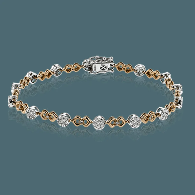 Women’s luxury cuff bracelets-This unique bracelet shows off a total 1.15 ctw of round white diamonds in white gold settings accented by charming rose gold details