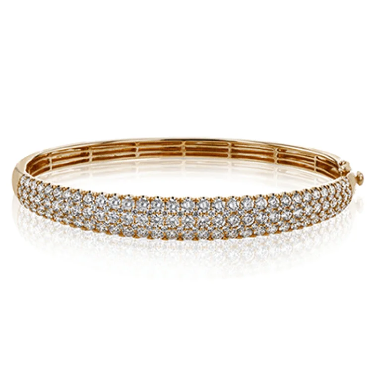 Women’s gold-plated bangles-This three-row 18k white gold bangle bracelet is sure to turn heads with 5.42 ctw of white diamonds.